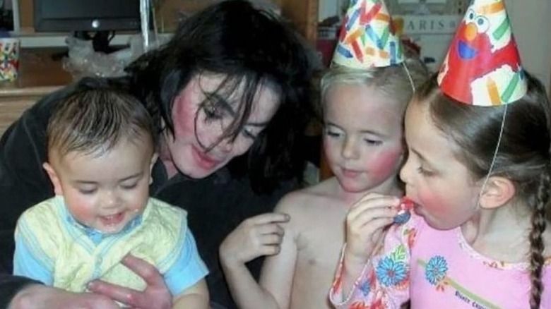Blanket, left, with Michael, Prince (second to far right), and Paris Jackson together