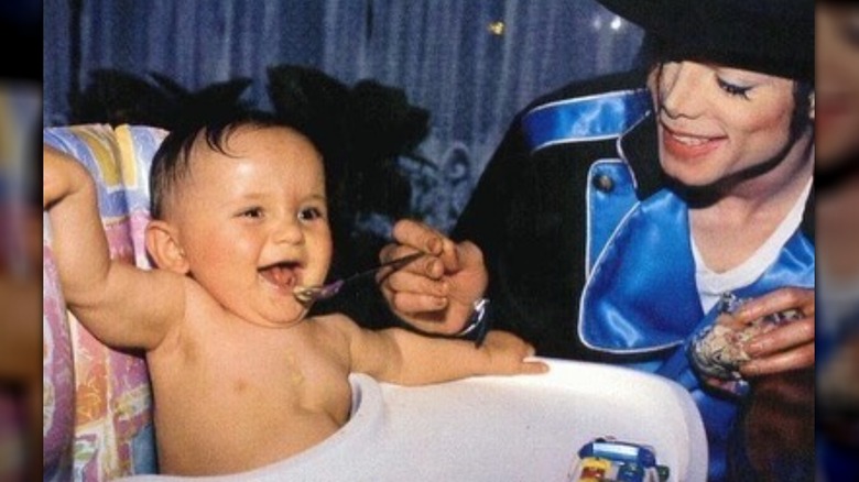 Prince Jackson as a baby with his father Michael