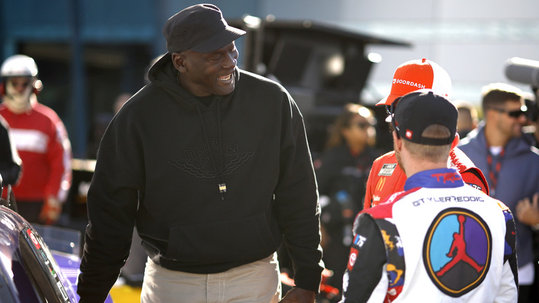 Michael Jordan smiling at NASCAR race