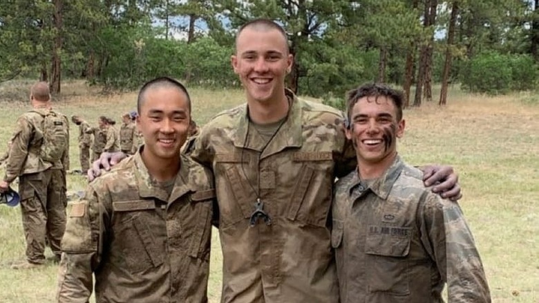 Paul Skenes smiling in uniform alongside friends