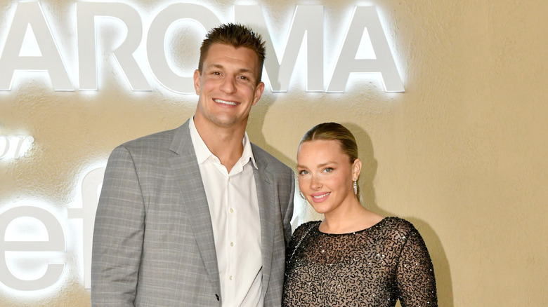 Rob Gronkowski and Camille Kostek posing