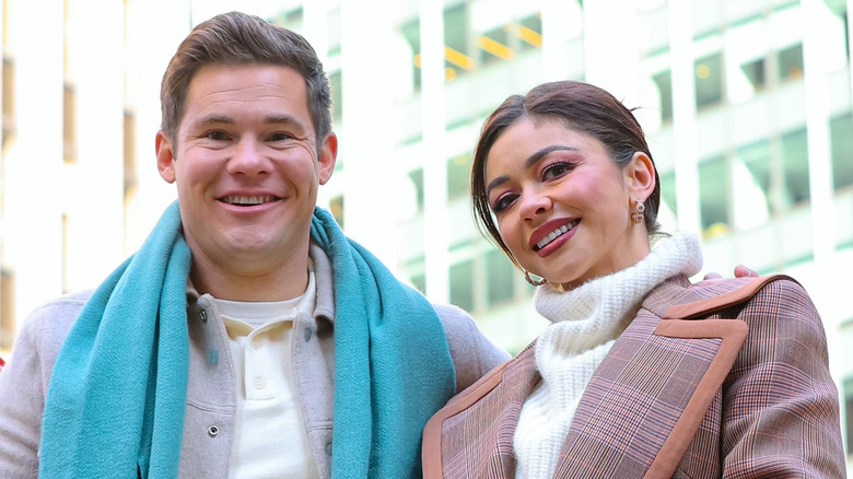 Adam Devine and Sarah Hyland grinning