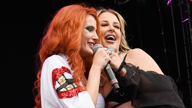 Tana Mongeau and Bella Thorne performing together