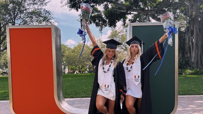 The Cavinder twins in their graduation gown and cap.