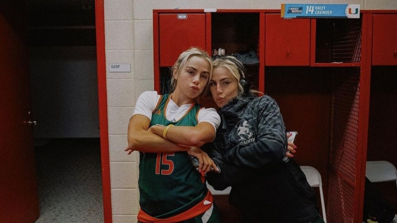 The Cavinder twins posing in their Miami locker room.