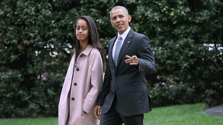 Malia Obama and Barack Obama