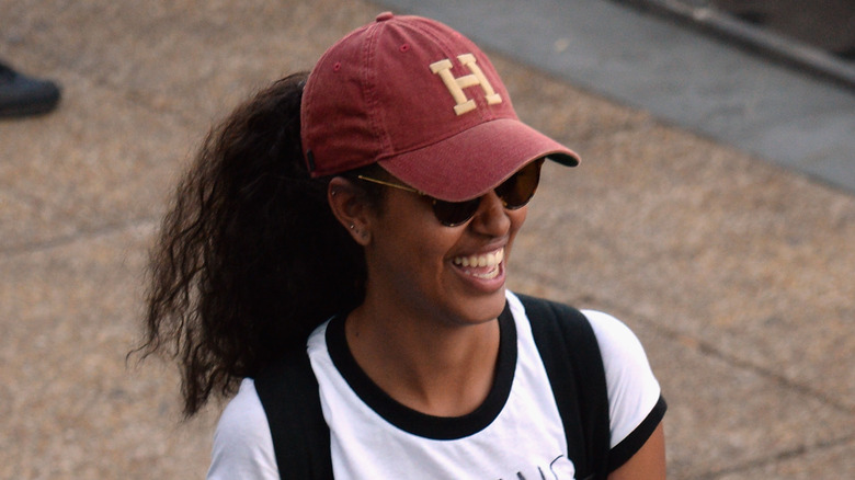 Malia Obama wearing a Harvard hat