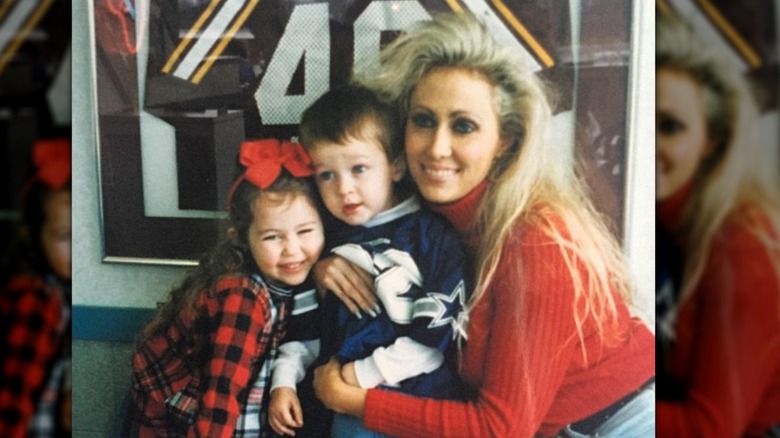 Tish posing with Miley and Braison Cyrus when they were kids