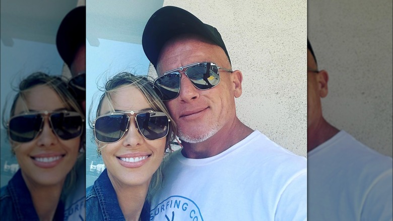 Tish Cyrus and Dominic Purcell posing together