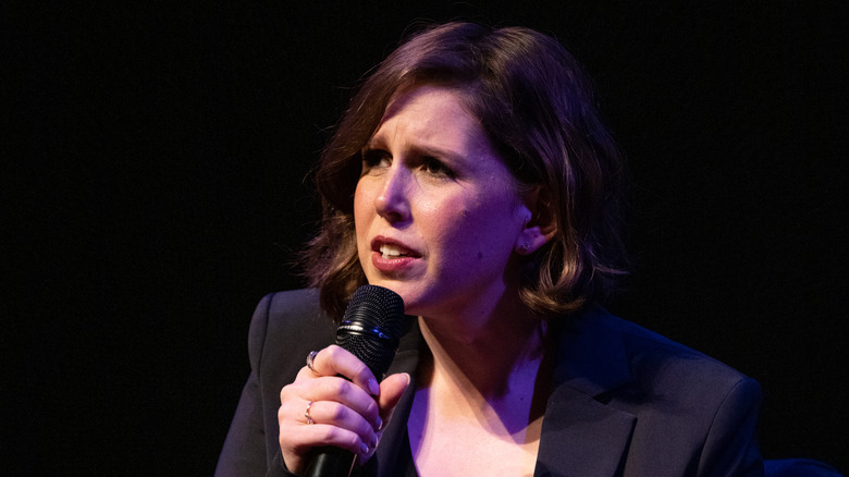 Vanessa Bayer talking into a microphone