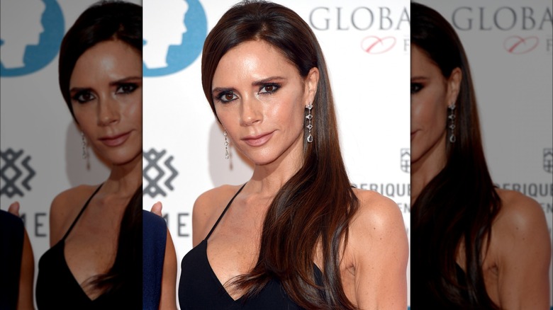 Victoria Beckham wearing shiny earrings