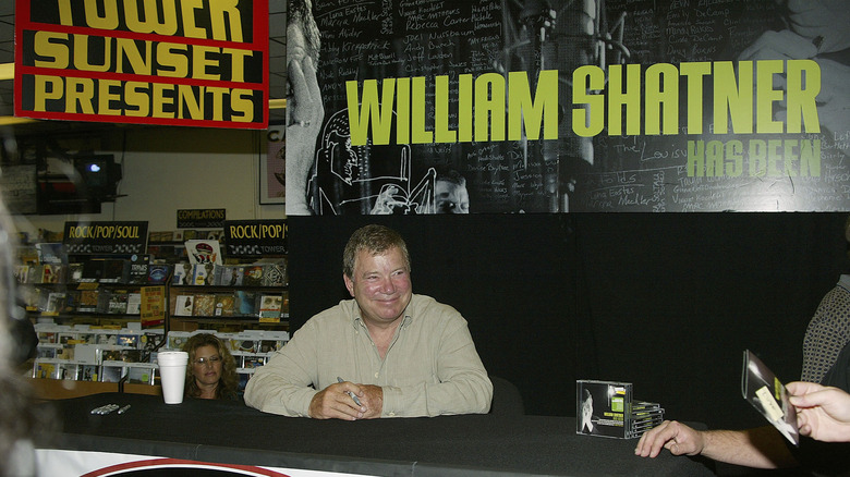 William Shatner smiling at a record store