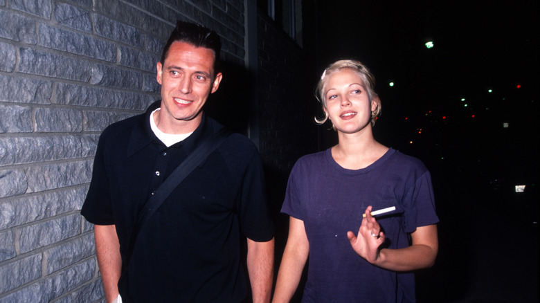 Jeremy Thomas and Drew Barrymore walking