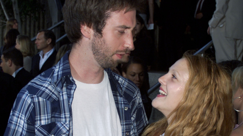 Drew Barrymore looking up at Tom Green