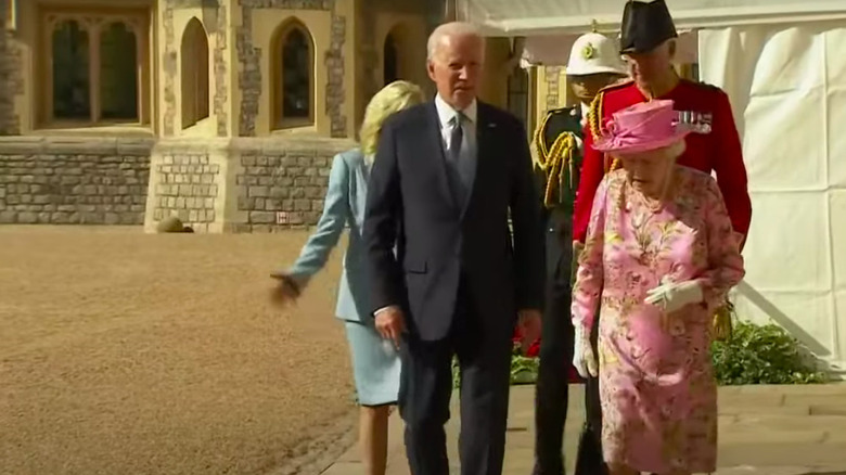 Joe Biden walking with Queen Elizabeth