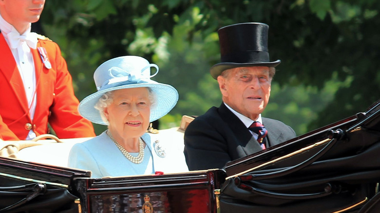 Queen Elizabeth and Prince Philip smiling 