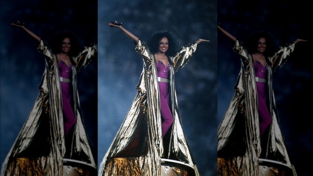 Diana Ross rocking a floor-length gold coat during the Super Bowl XXX halftime show 