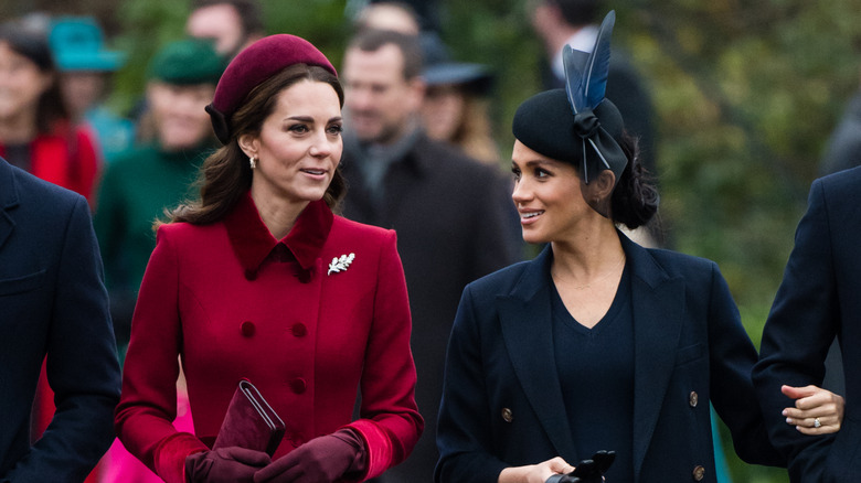 Kate Middleton and Meghan Markle talking