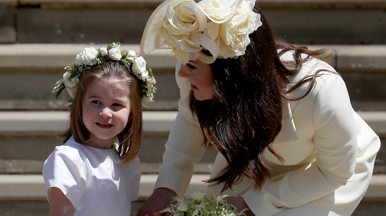 Kate Middleton tending to Princess Charlotte