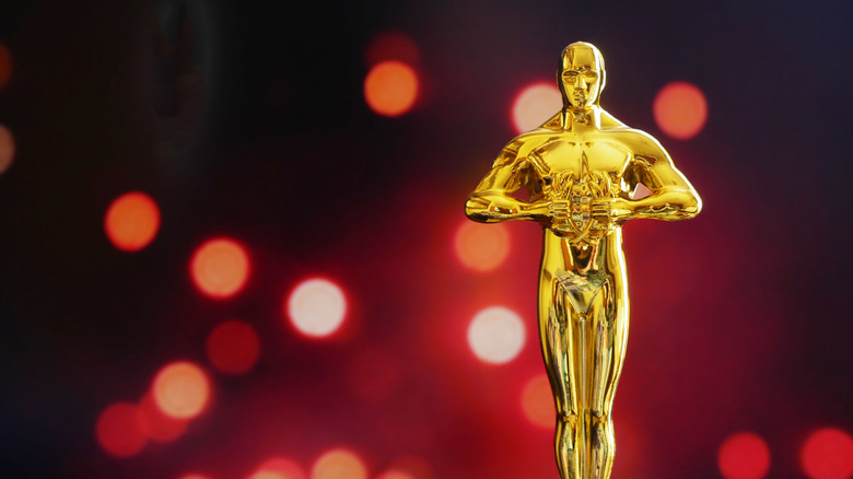 Hollywood Golden Oscar Academy award statue. Success and victory concept.  by: LanKS