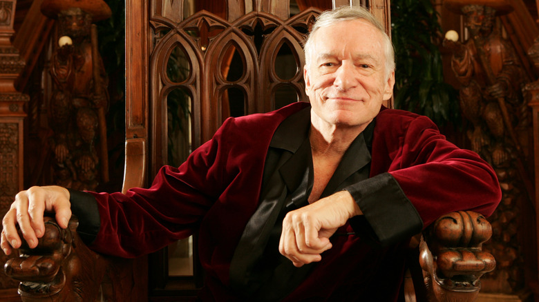 Hugh Hefner seated and smiling