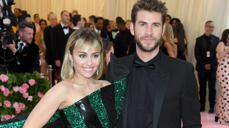 Miley Cyrus and Liam Hemsworth smiling together