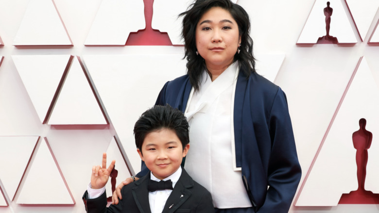 Alan Kim and Christine Oh posing on Oscars red carpet