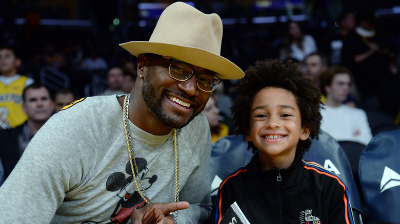 Taye and Walker Diggs at a basketball game in January 2022.