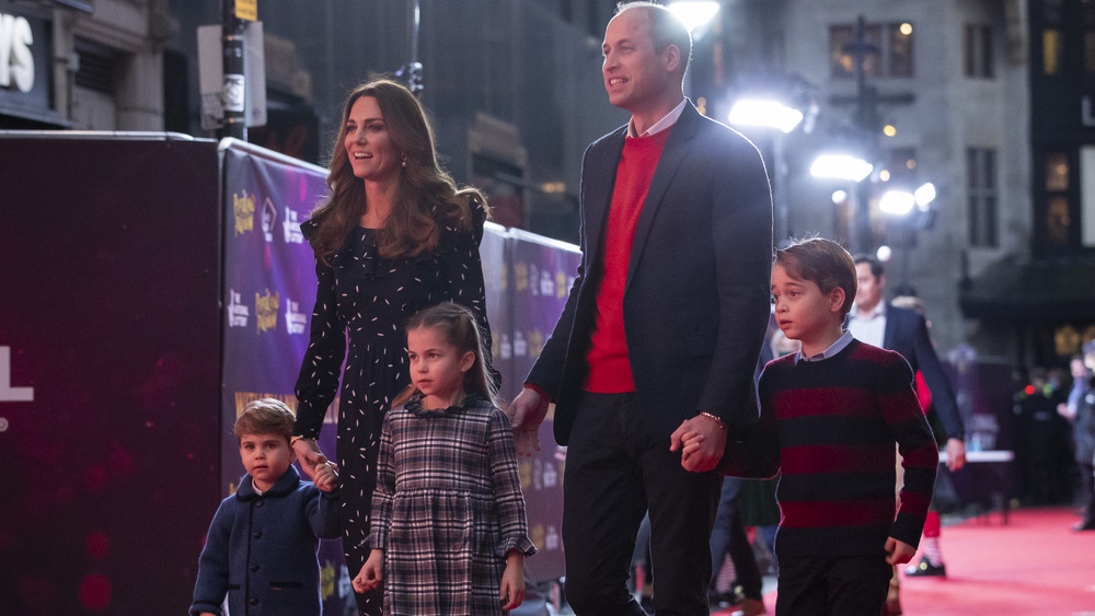 Kate Middleton and Prince William on the red carpet with their children, Louis, Charlotte, and George