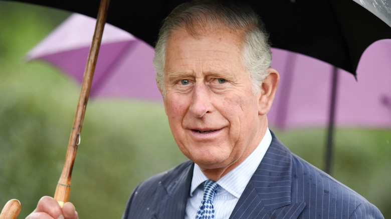 Prince Philip with umbrella 