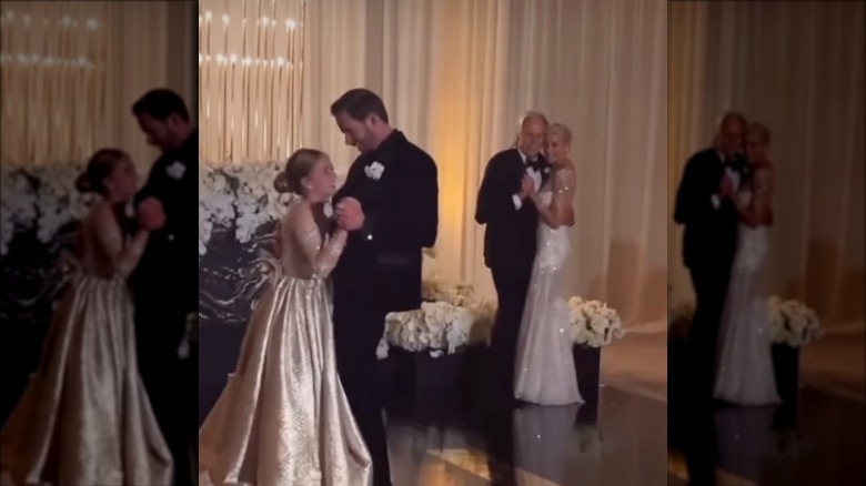 Tarek and Heather Rae El Moussa pose with their kids at their wedding