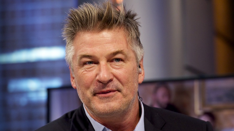 Alec Baldwin wearing an earpiece