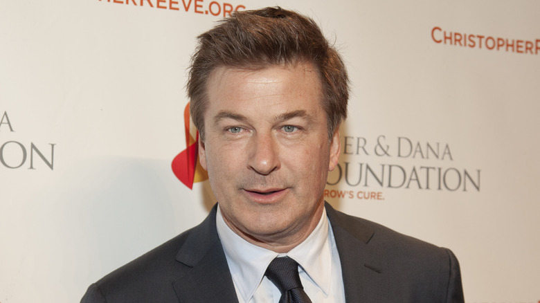 Alec Baldwin in a grey suit