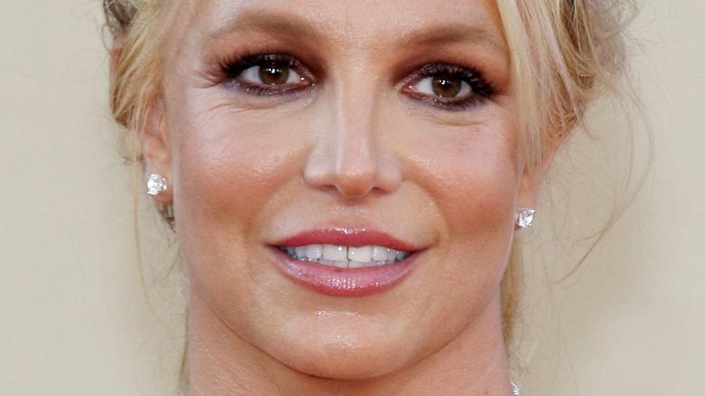 Britney Spears smiling with blonde hair