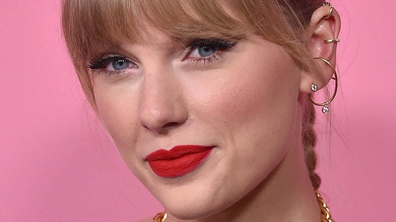 Taylor Swift half smiling hair in braid 