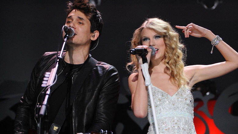 Taylor Swift and John Mayer performing onstage