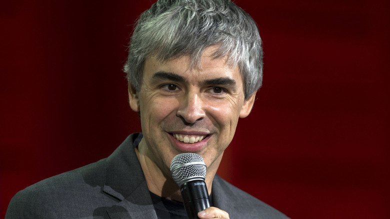 Larry Page smiling into microphone