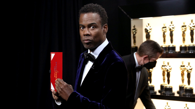 Chris Rock stand backstage at the Academy Awards