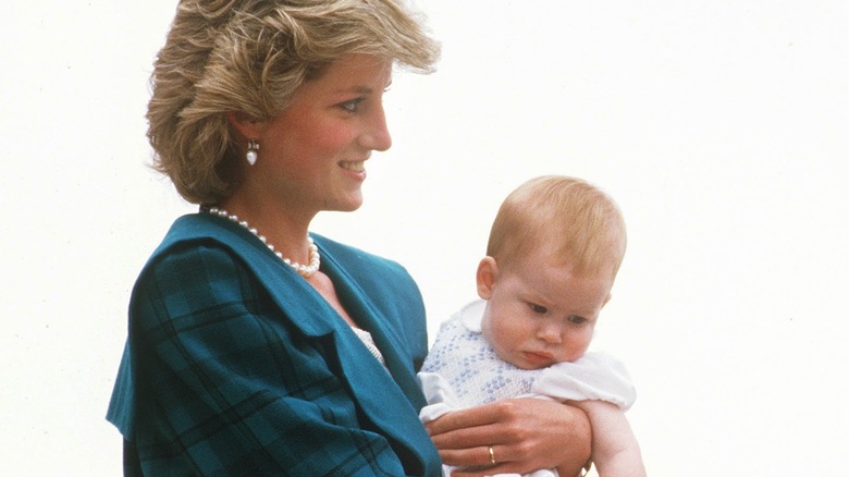 Princess Diana holding Prince Harry