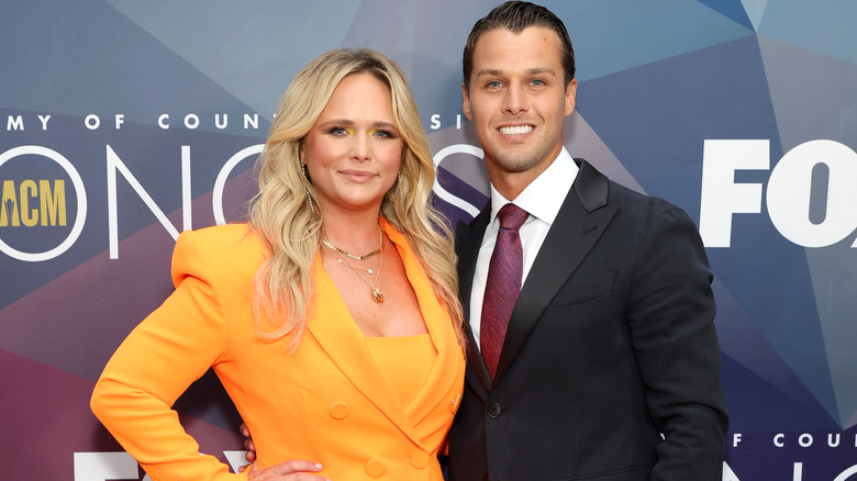 Miranda Lambert and her husband posing at an honors show