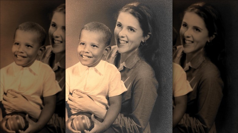 Young Barack Obama sits in his mother's lap