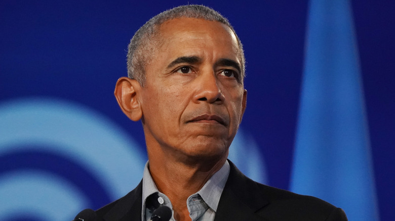 Barack Obama with a serious expression during a speech