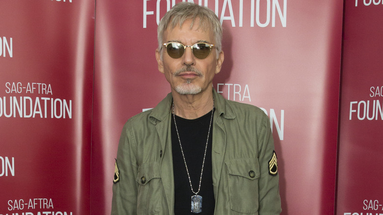 Billy Bob Thornton wearing an army jacket on red carpet