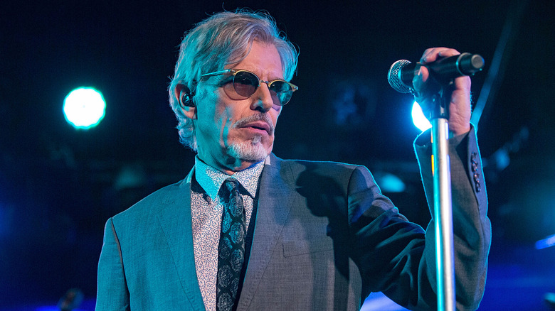 Billy Bob Thornton on stage holding a microphone