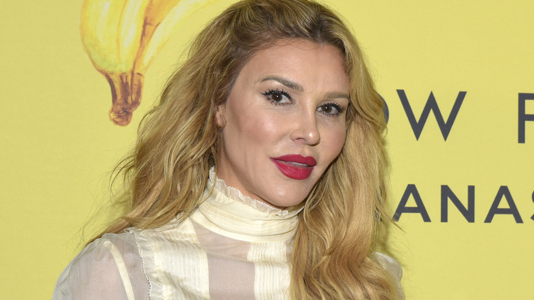 Brandi Glanville walks the red carpet.