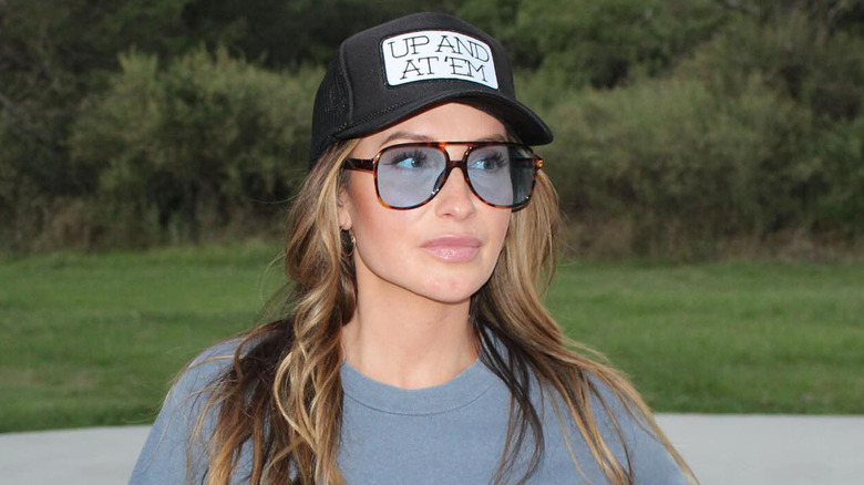 Bristol Palin wearing a hat and sunglasses outdoors