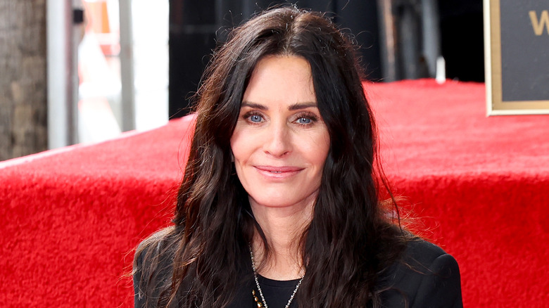 Courteney Cox smiling on red carpet