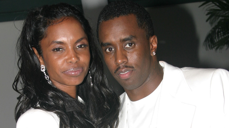 Kim Porter posing with Diddy