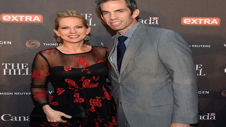 Shannon Bream with her husband on a red carpet.