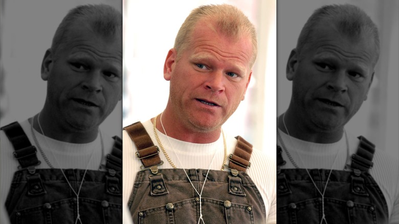 Mike Holmes in overalls